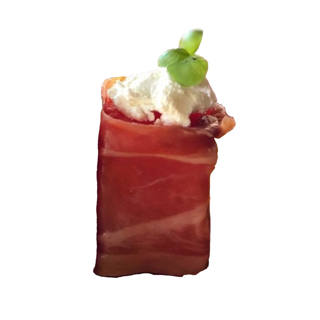 Watermelon and prosciutto canapé topped with creamy feta cheese and a microgreen garnish for gourmet catering events.